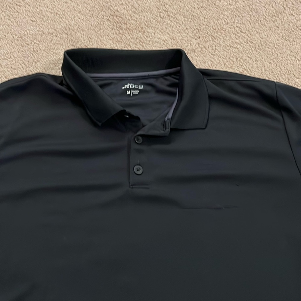 Men’s black polo size Medium